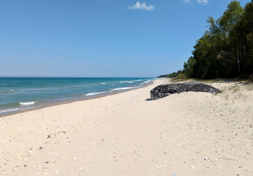 on the Cedar Cliff Cottage beach looking south toward Sacred Rock