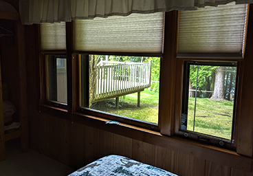 looking outside from the windows in the main bedroom of Cedar Cliff Cottage