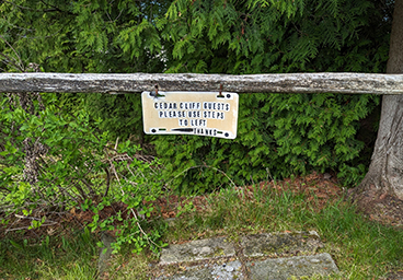 close up of a sign on guardrail at Cedar Cliff Cottage